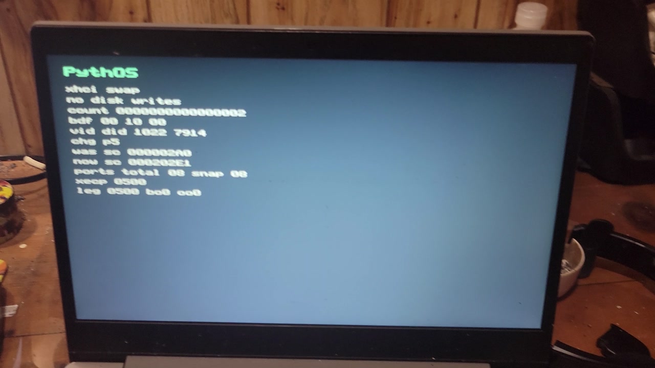PythOS USB xHCI swap probe showing port 5 connect after boot USB removal on physical hardware