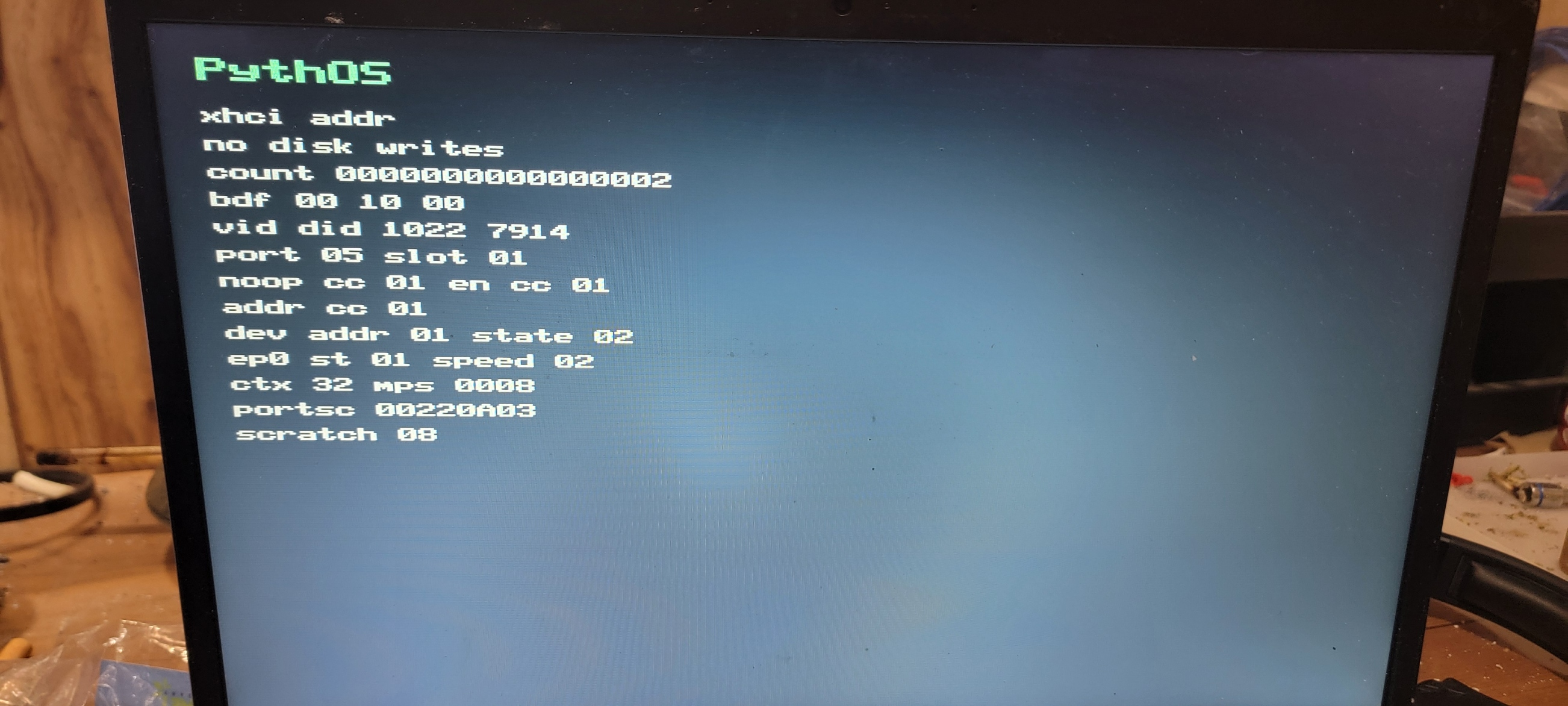 PythOS USB xHCI address probe showing Address Device completion on physical hardware