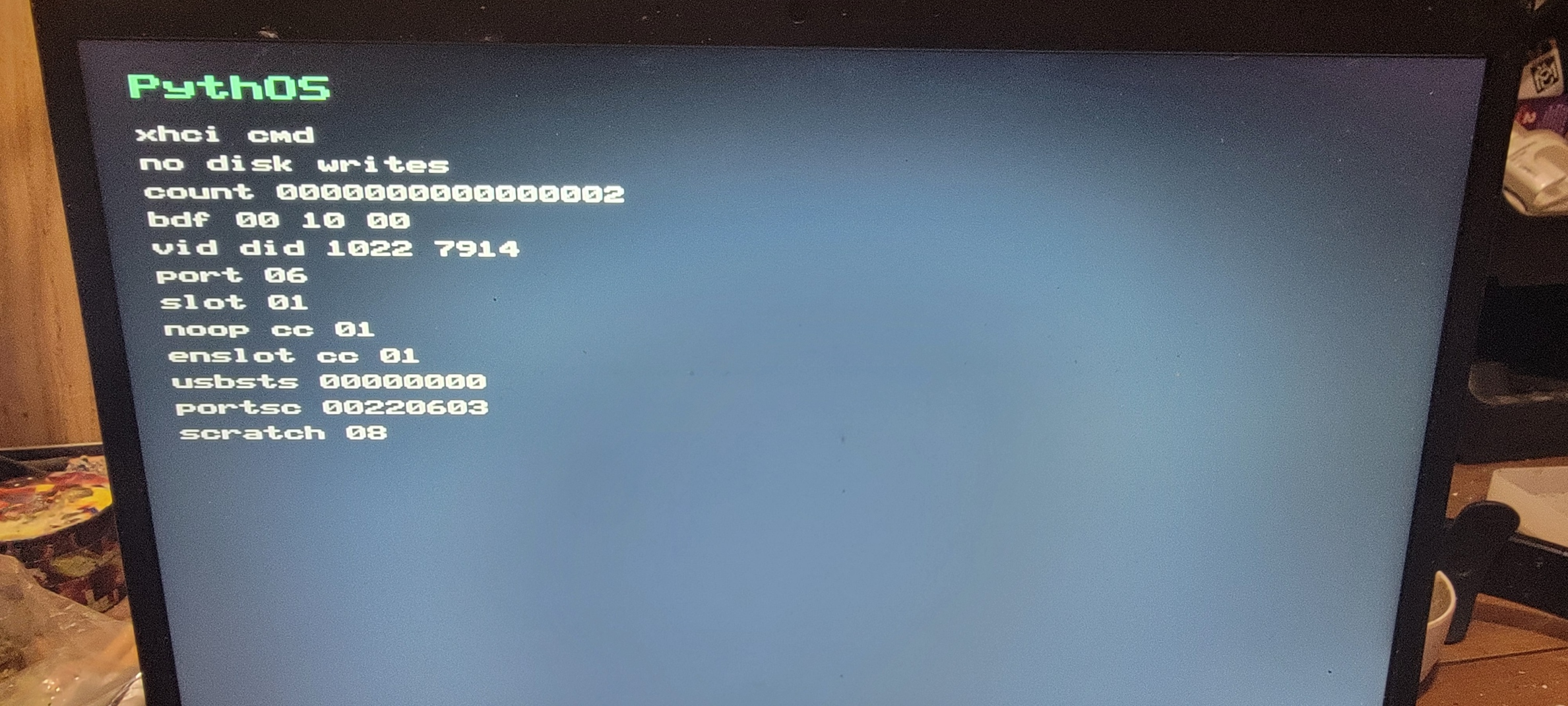 PythOS USB xHCI command probe showing No-op and Enable Slot completion on physical hardware